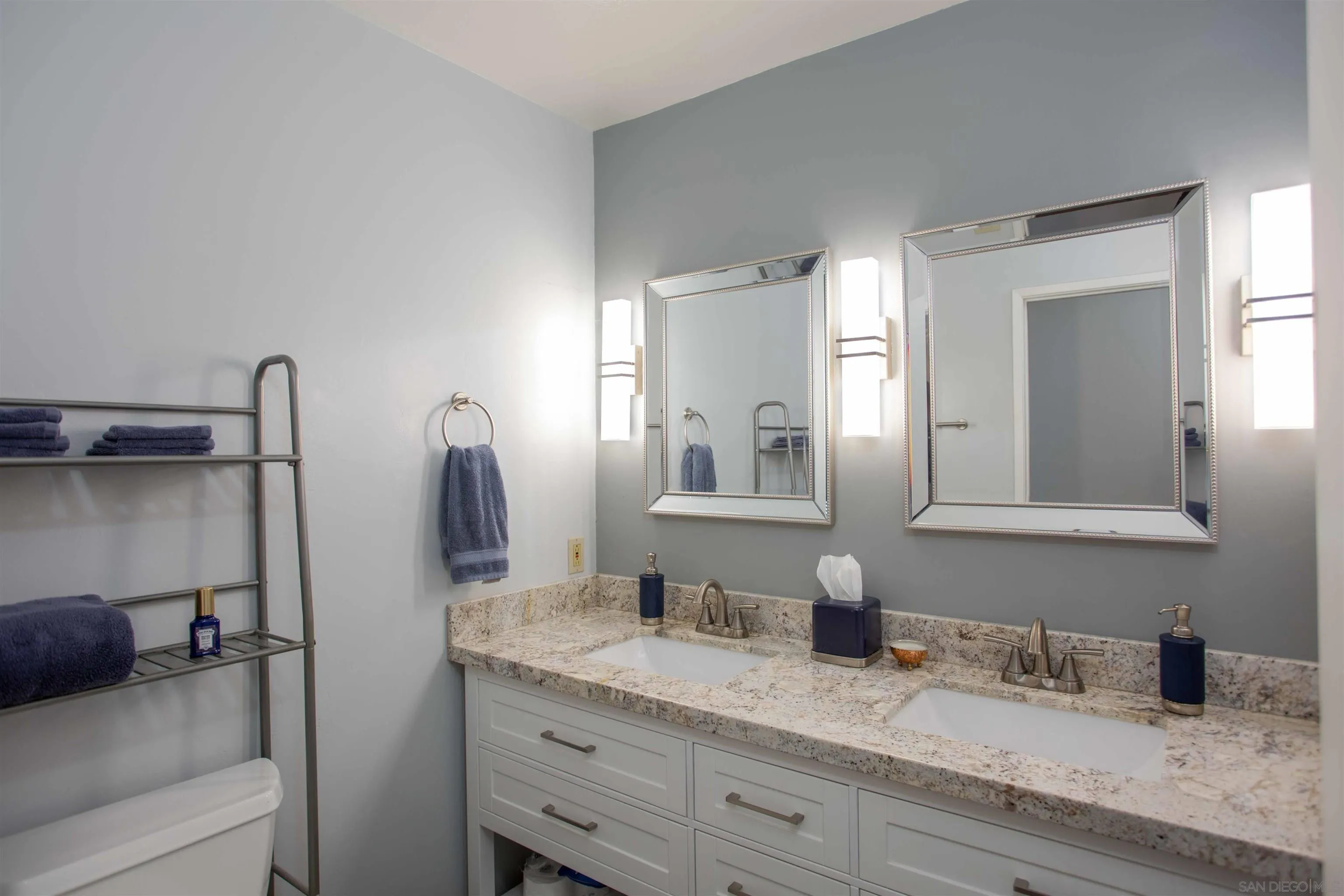 9182 Emden Road San Diego, CA 92129 - Photo 15 of 27 a bathroom with a granite countertop sink and a mirror