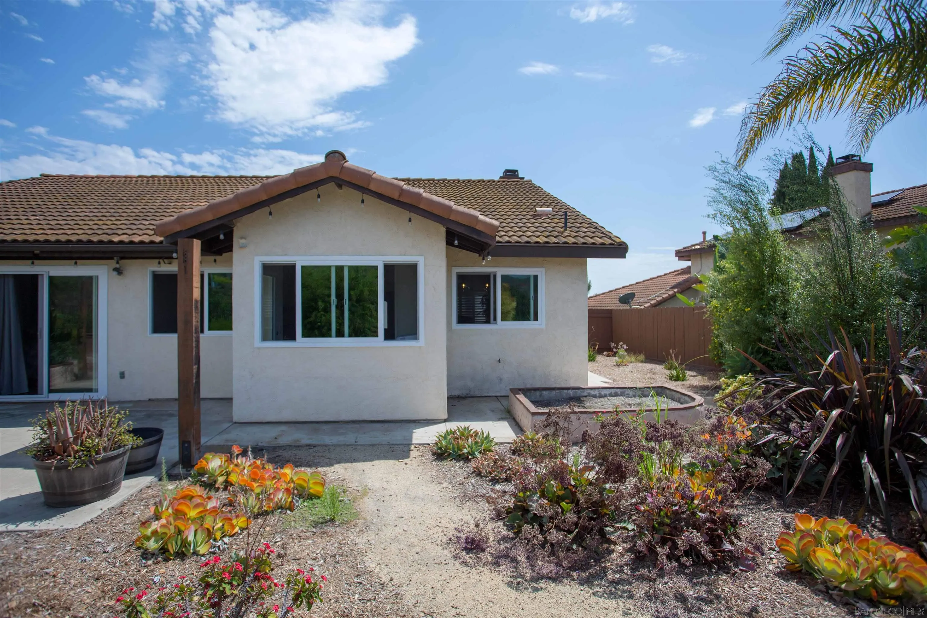 9182 Emden Road San Diego, CA 92129 - Photo 24 of 27 a front view of a house with a yard
