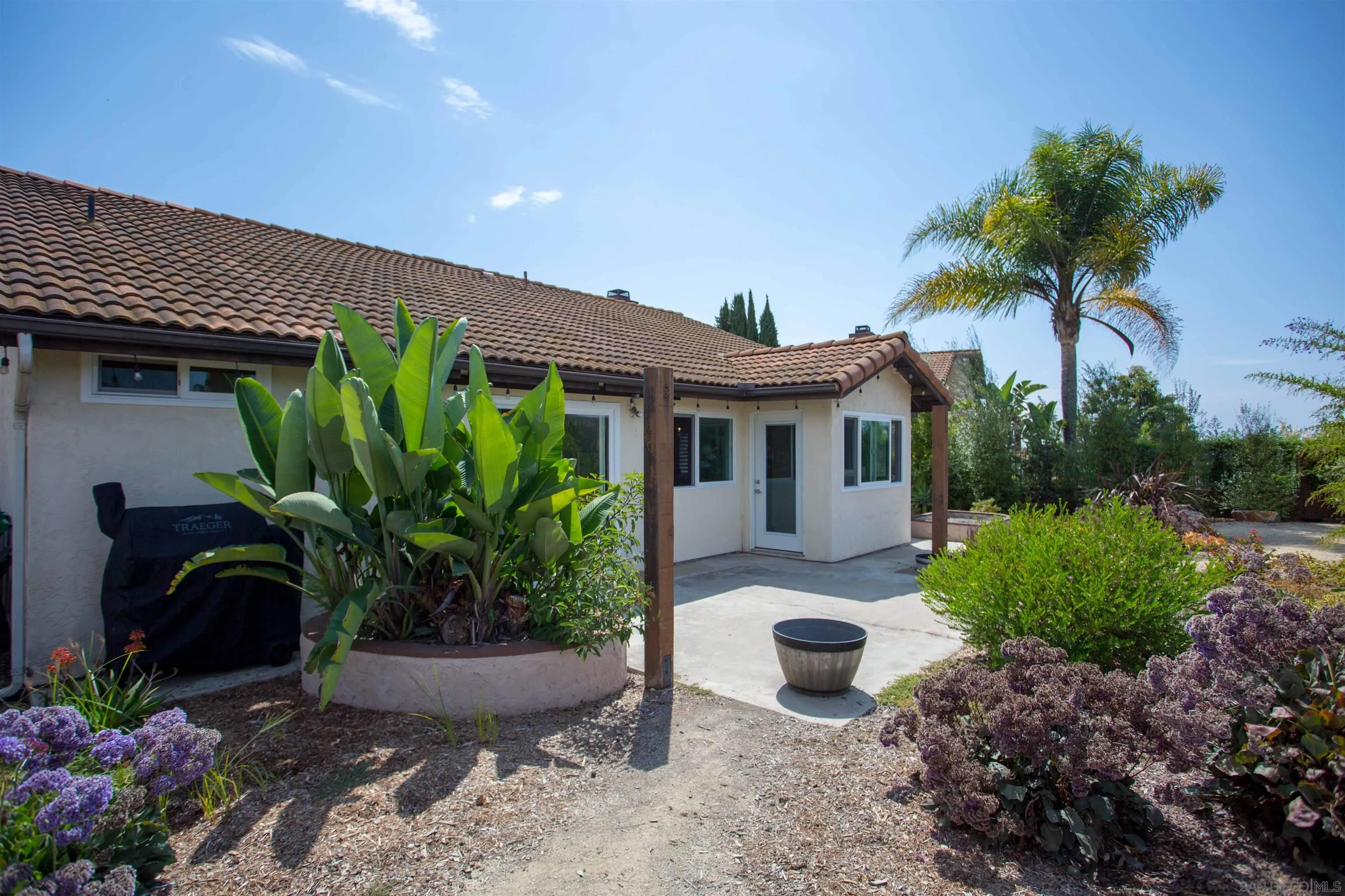 9182 Emden Road San Diego, CA 92129 - Photo 25 of 27 a front view of a house with garden