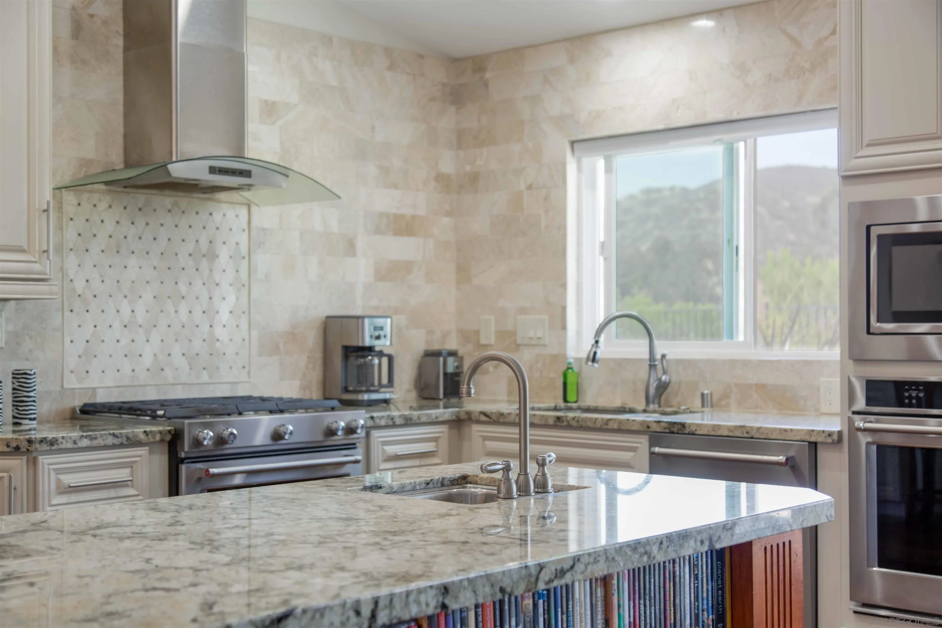 9182 Emden Road San Diego, CA 92129 - Photo 6 of 27 a kitchen with stainless steel appliances granite countertop a sink and a stove
