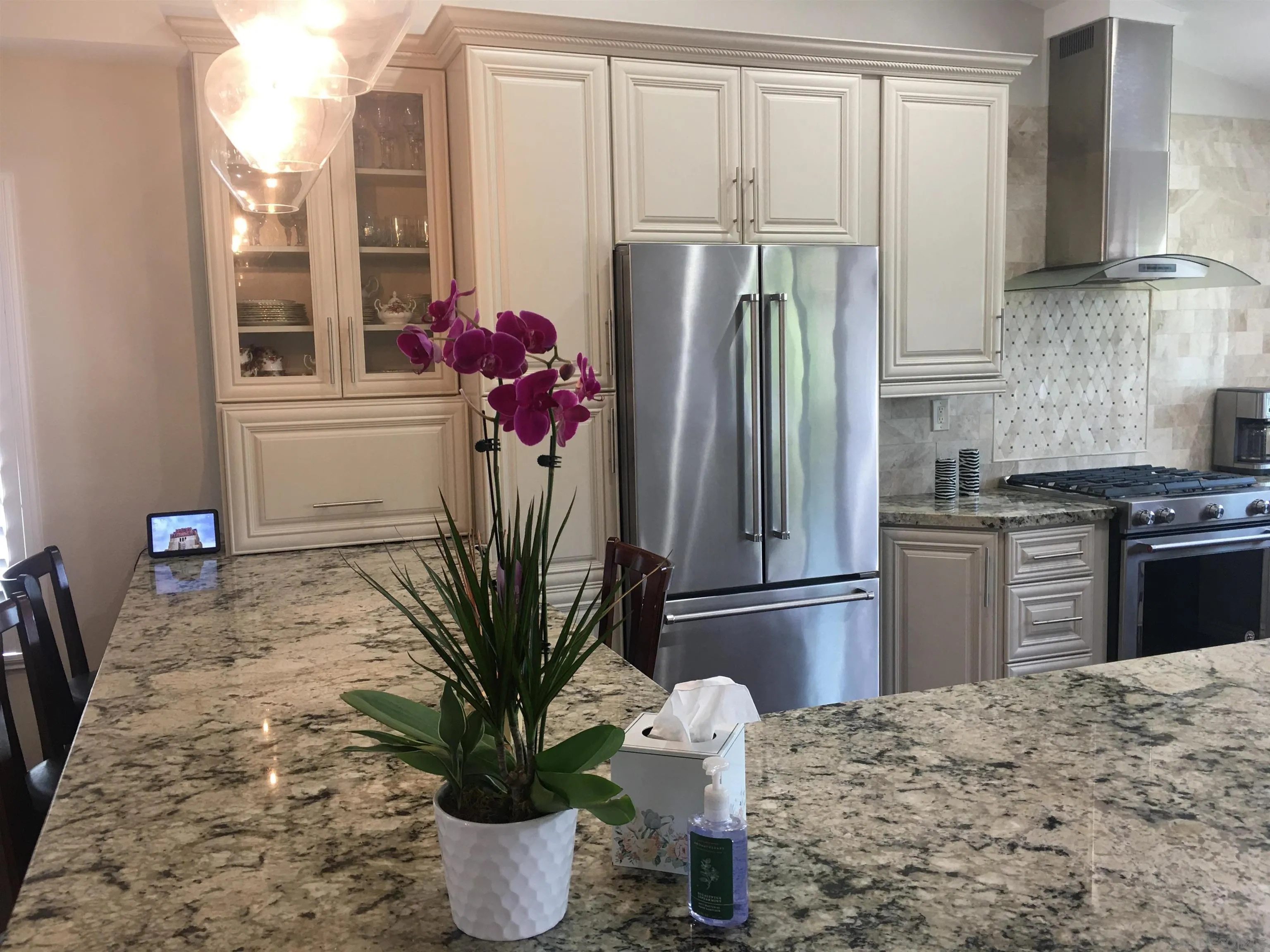 9182 Emden Road San Diego, CA 92129 - Photo 8 of 27 a kitchen with stainless steel appliances granite countertop a refrigerator and a stove