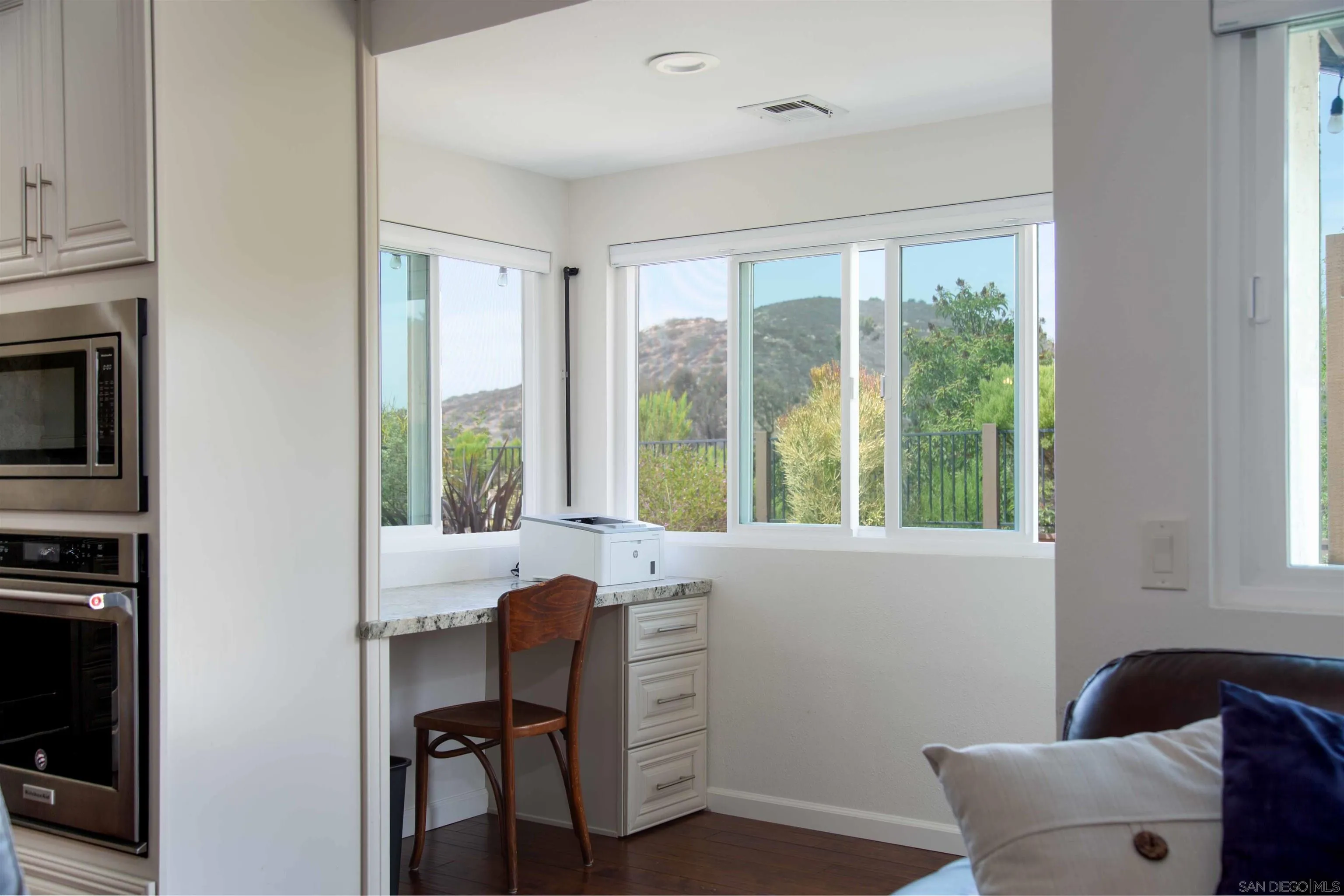 9182 Emden Road San Diego, CA 92129 - Photo 10 of 27 a view of a workspace with furniture and a window