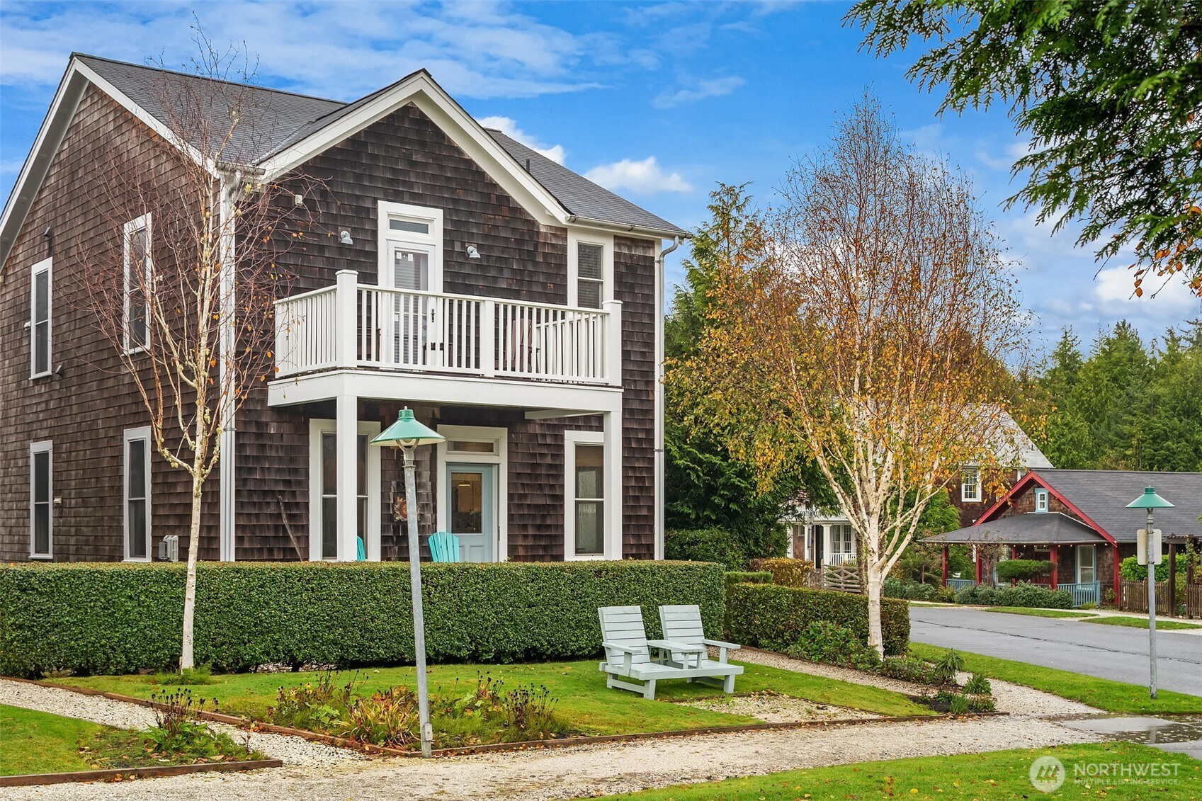 24 Float Lane Pacific Beach, WA 98571 - Photo 11 of 23 a view of a brick house with a yard plants and large trees