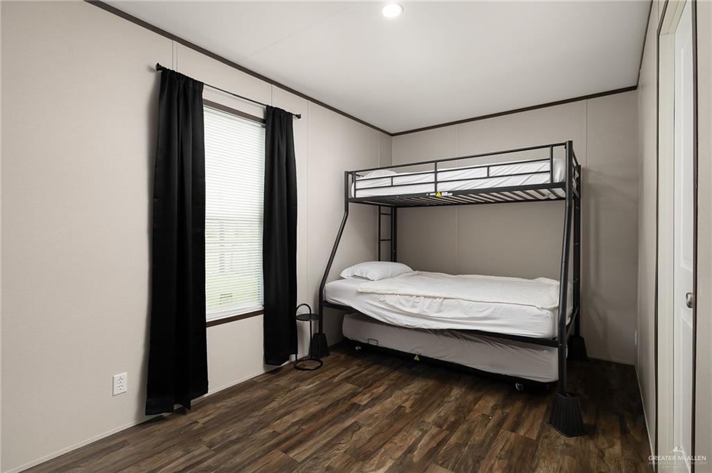 35237 General Brant Road Rio Hondo, TX 78583 - Photo 15 of 27 a bedroom with a bed and a window