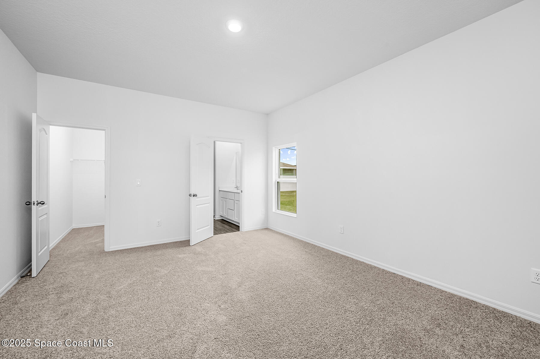 435 Olney Street Palm Bay, FL 32908 - Photo 11 of 18 a view of an empty room with a window