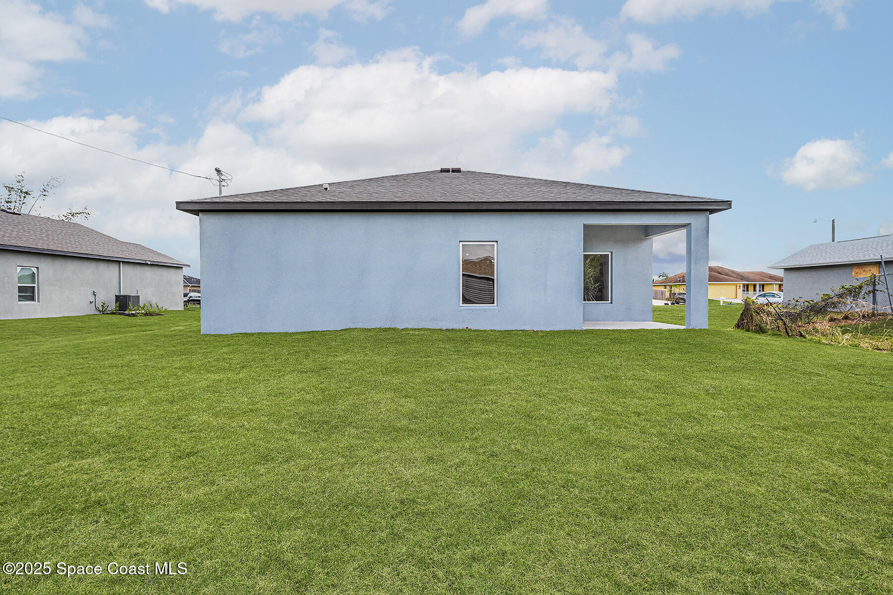 435 Olney Street Palm Bay, FL 32908 - Photo 3 of 18 a house view with a garden space
