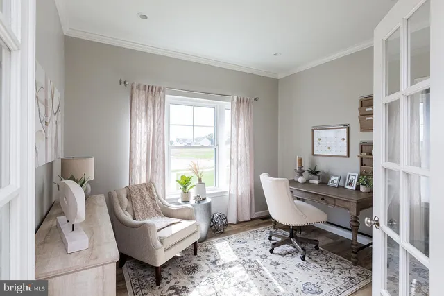 a living room with furniture a window and a lamp
