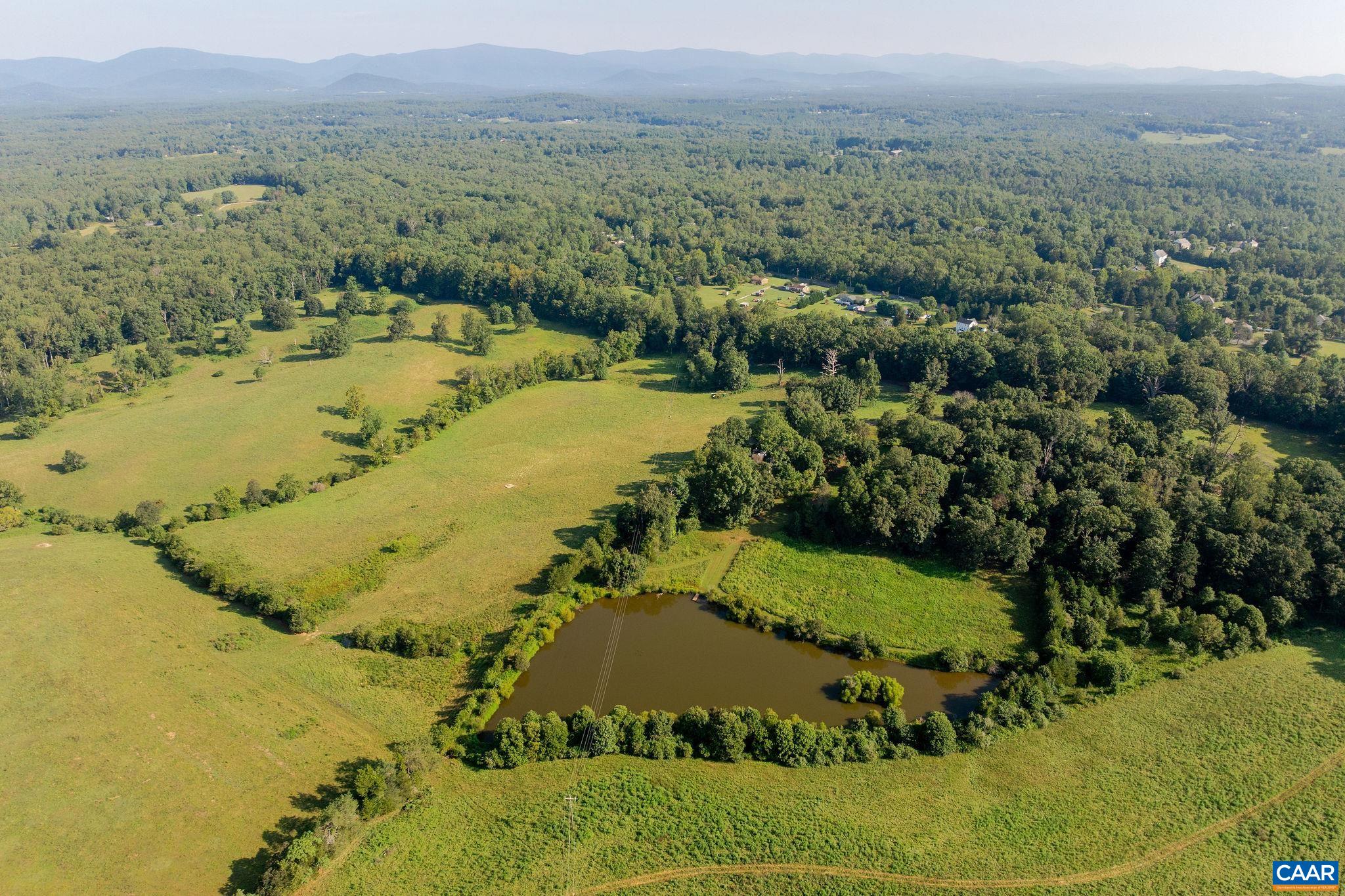 3260 Earlysville Road Earlysville, VA 22936 - Photo 34 of 42 a view of a lake with mountains in the background