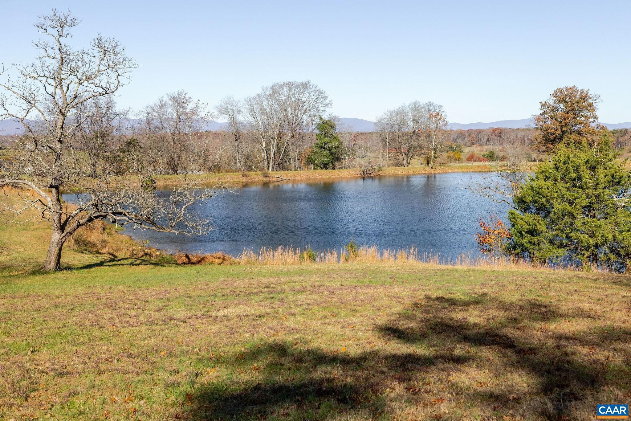 3260 Earlysville Road Earlysville, VA 22936 - Photo 5 of 42 a view of a lake with houses