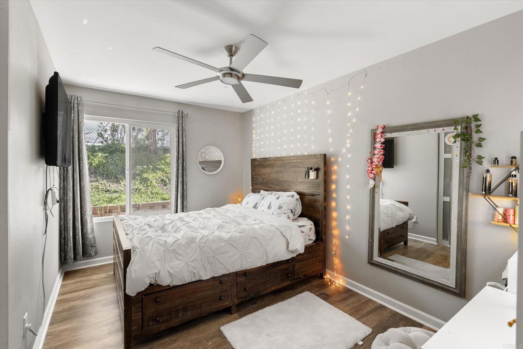 18027 Cotorro Road San Diego, CA 92128 - Photo 15 of 31 a bedroom with a bed and a mirror