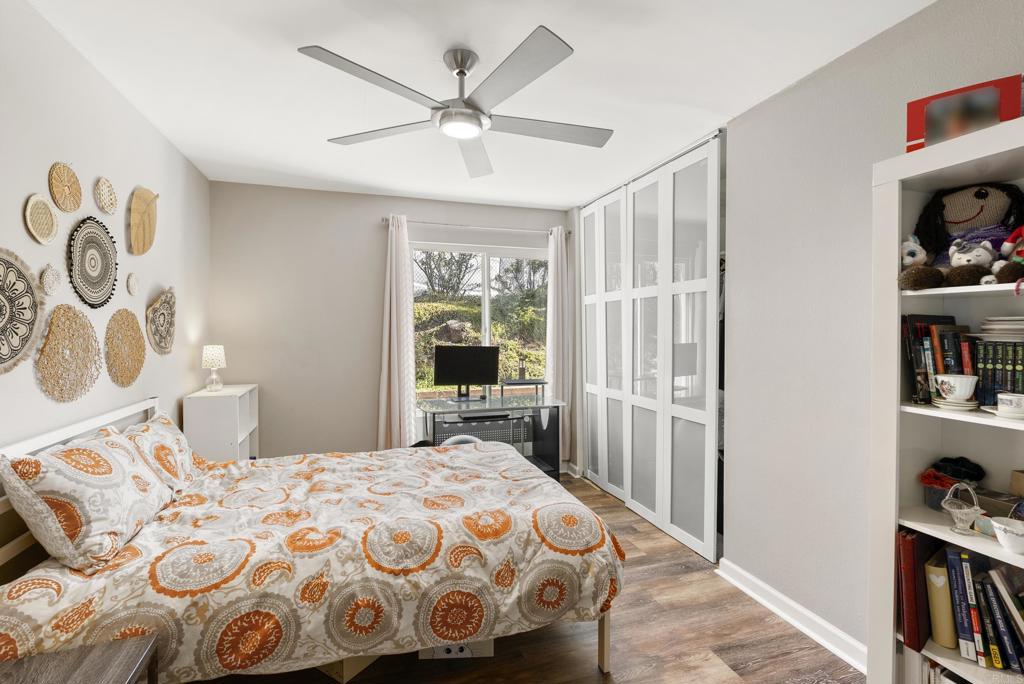18027 Cotorro Road San Diego, CA 92128 - Photo 16 of 31 a bedroom with a large bed and a book shelf