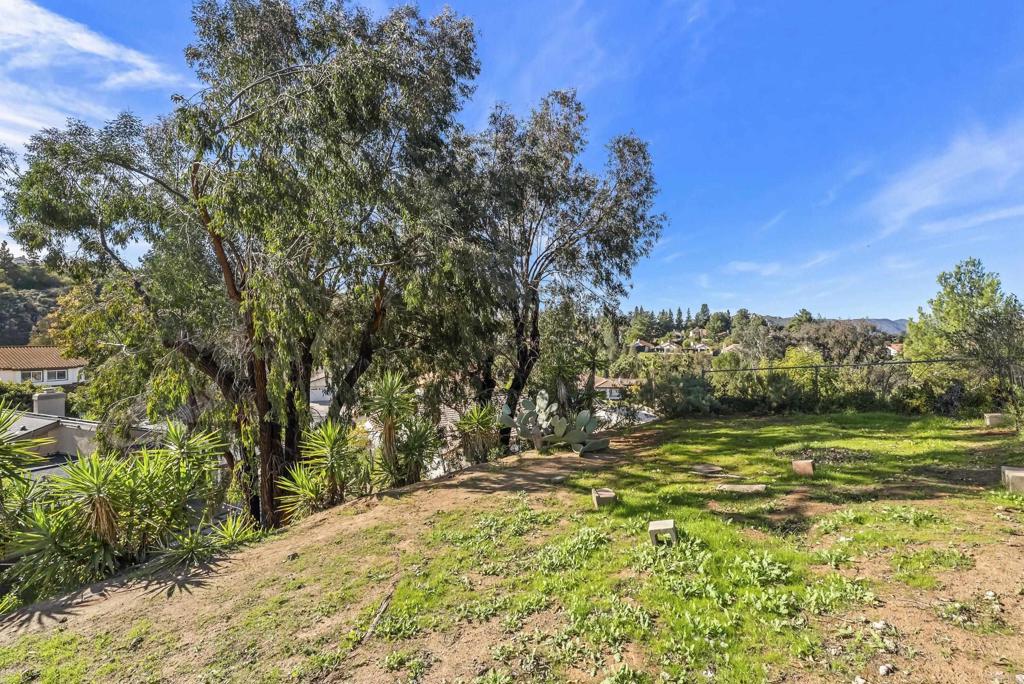 18027 Cotorro Road San Diego, CA 92128 - Photo 28 of 31 a view of a yard with an trees