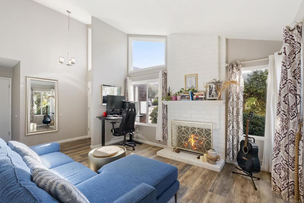 18027 Cotorro Road San Diego, CA 92128 - Photo 4 of 31 a living room with furniture and a fireplace