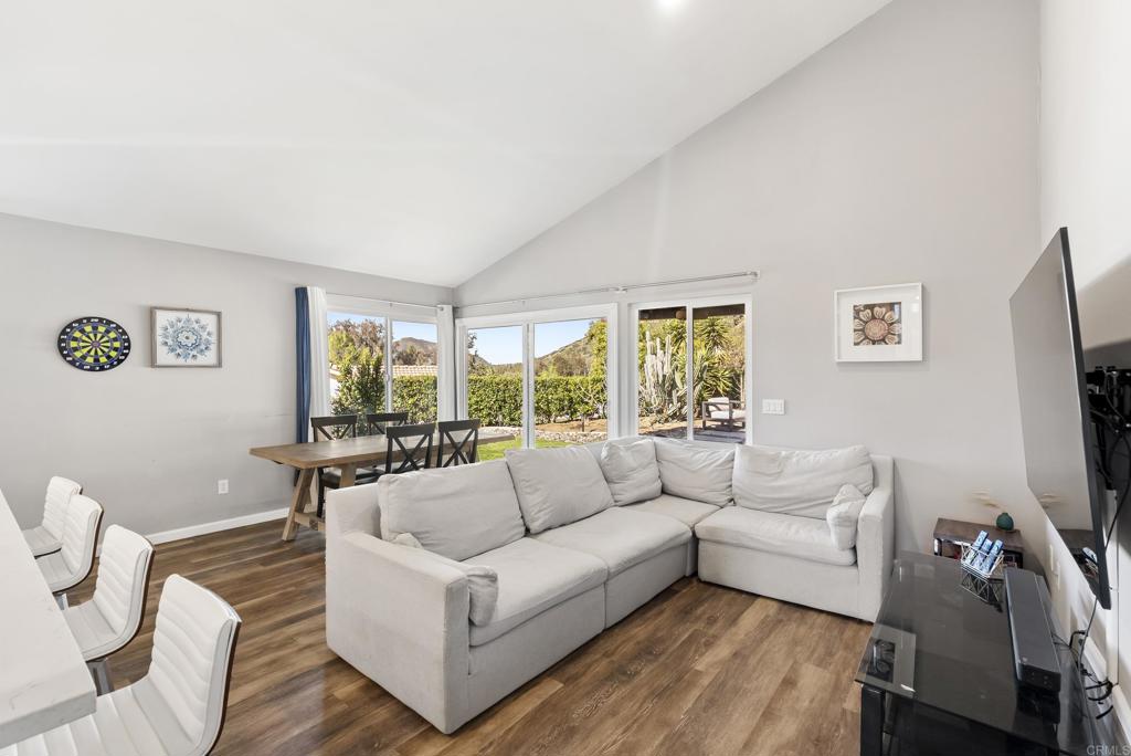 18027 Cotorro Road San Diego, CA 92128 - Photo 9 of 31 a living room with furniture and a flat screen tv