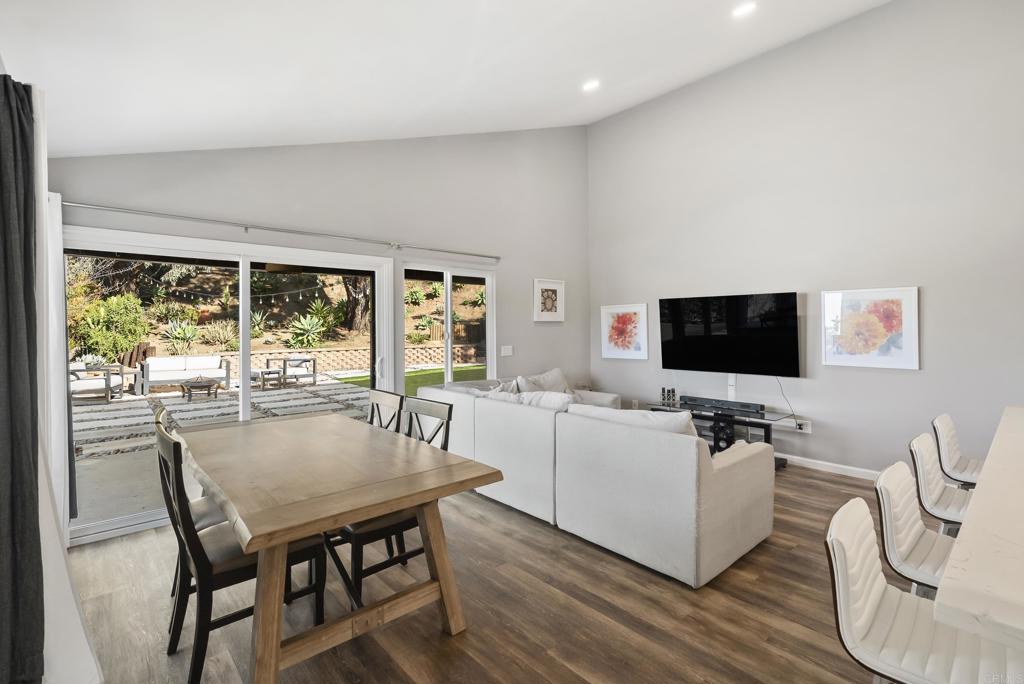 18027 Cotorro Road San Diego, CA 92128 - Photo 10 of 31 a view of a dining room with furniture and wooden floor