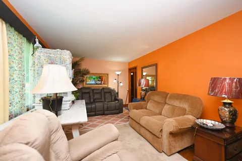a kitchen with stainless steel appliances kitchen island granite countertop a sink and cabinets