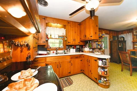 a dining room with furniture and a window