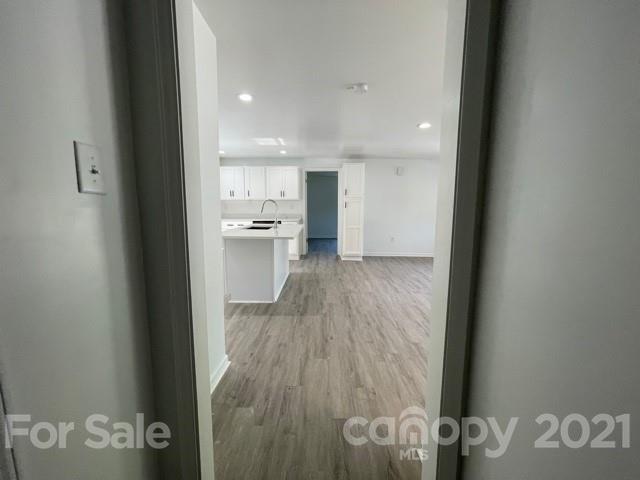 315 South Ransom Street Gastonia, NC 28052 - Photo 8 of 20 a view of a kitchen from the hallway
