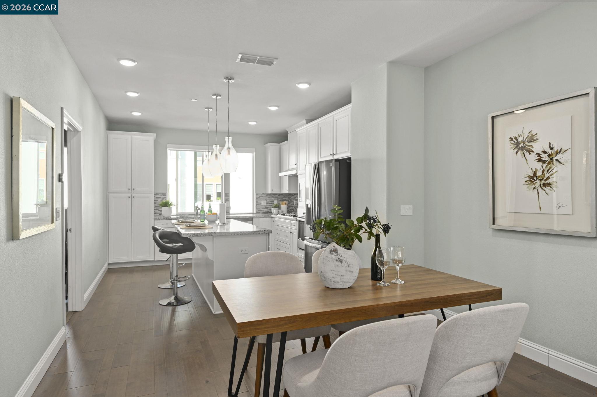 3923 Meridian Street Dublin, CA 94568 - Photo 14 of 39 a view of a dining room and livingroom with furniture wooden floor and a chandelier