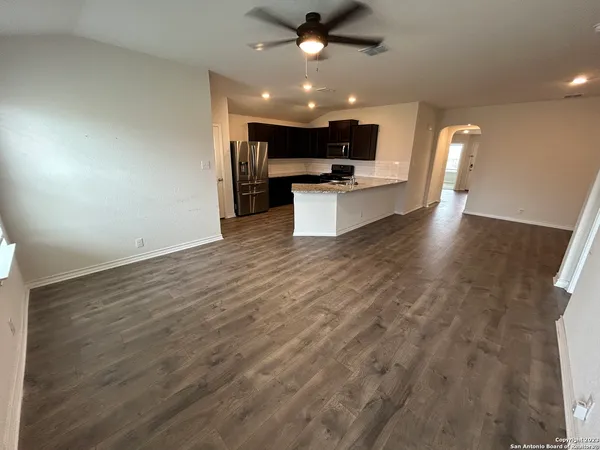 a view of kitchen with cabinets and wooden floor