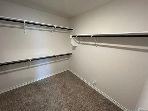 a view of an empty walk in closet