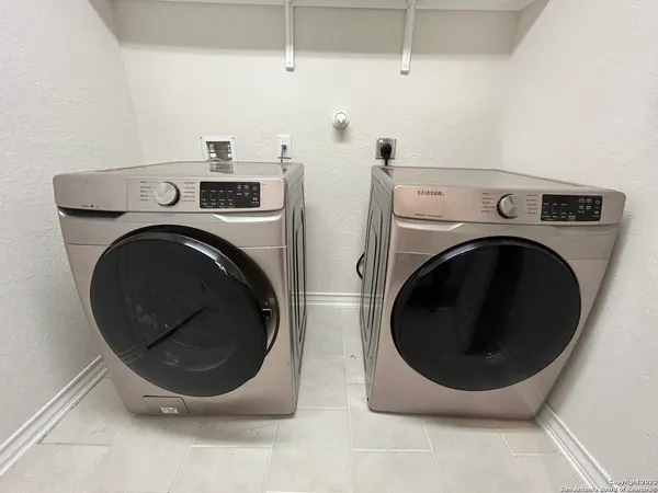 a utility room with dryer and washer