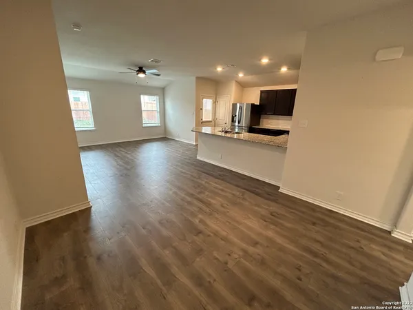 a view of kitchen with cabinets and wooden floor