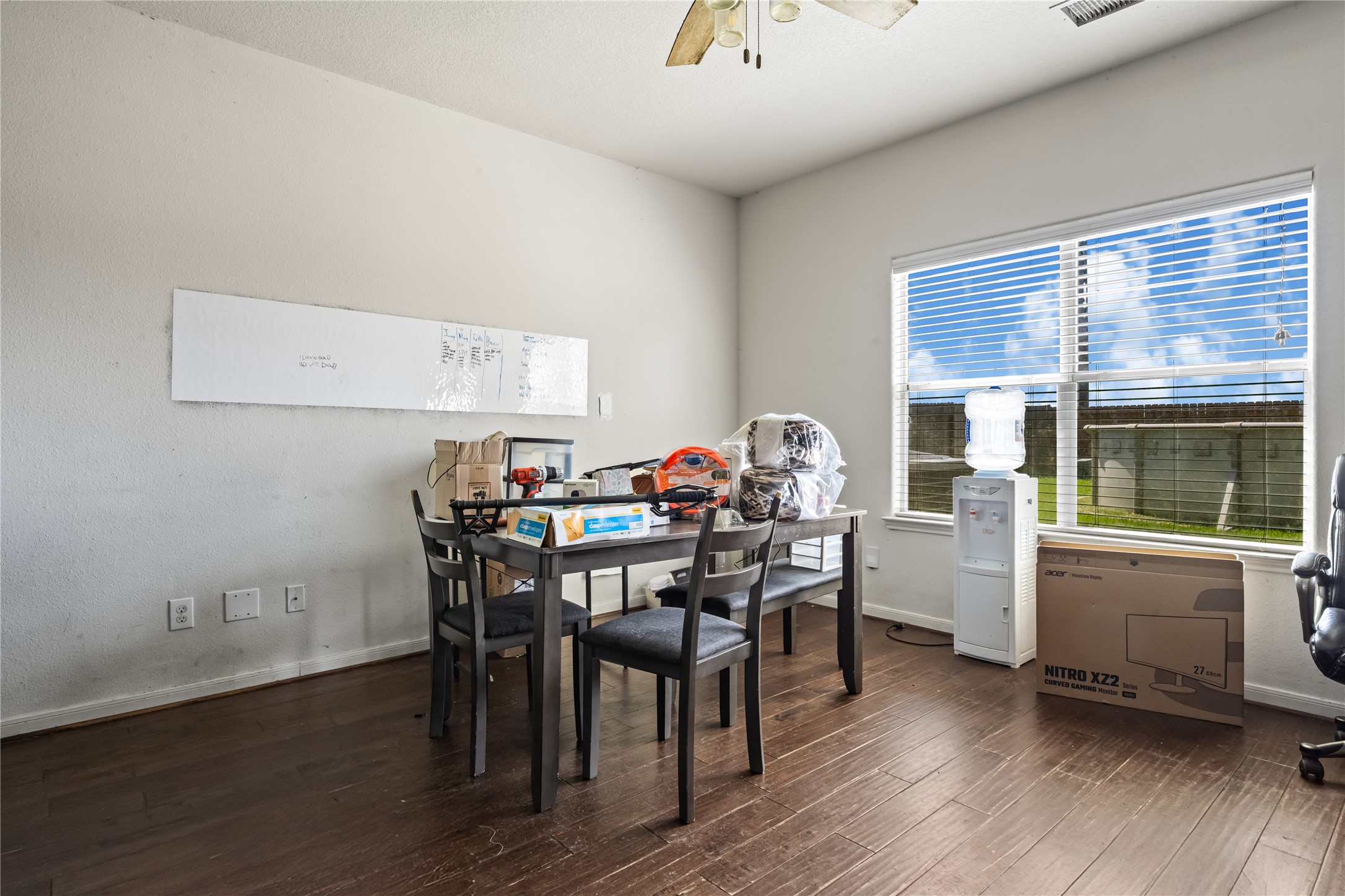28832 San Bernard River Loop Spring, TX 77386 - Photo 11 of 50 a view of a dining room with furniture and wooden floor