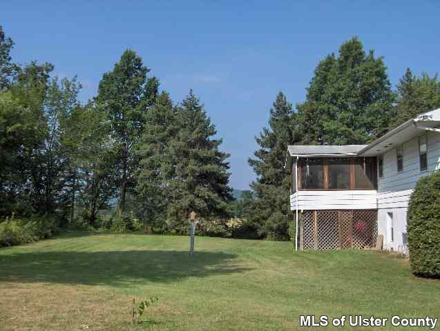 607 Old Rte 32, Unit LANE OFF OLD ROUTE 32 New Paltz, NY 12561 - Photo 1 of 6 a view of a yard in front of a house with a tree