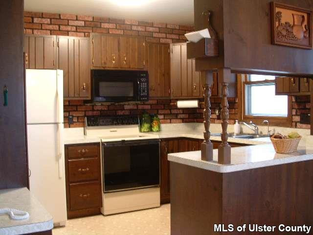 607 Old Rte 32, Unit LANE OFF OLD ROUTE 32 New Paltz, NY 12561 - Photo 4 of 6 a bathroom with a sink and a mirror