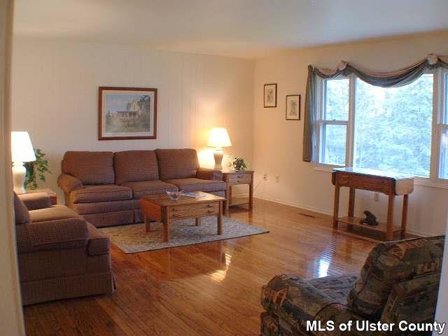 607 Old Rte 32, Unit LANE OFF OLD ROUTE 32 New Paltz, NY 12561 - Photo 5 of 6 a living room with furniture and a large window
