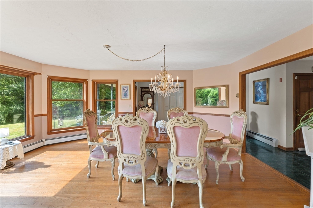 103 Renshaw Road Weare, NH 03281 - Photo 15 of 42 a view of a dining room with furniture window and wooden floor
