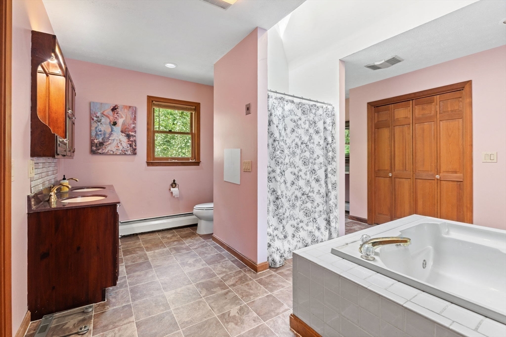 103 Renshaw Road Weare, NH 03281 - Photo 23 of 42 a bathroom with a tub sink and mirror