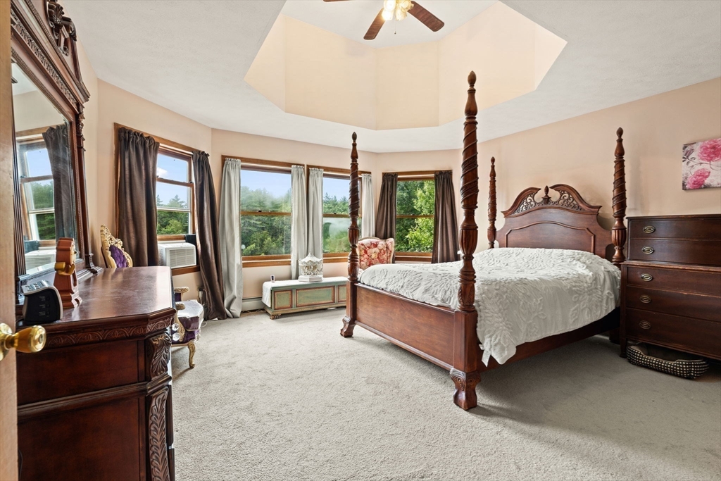 103 Renshaw Road Weare, NH 03281 - Photo 27 of 42 a bedroom with a bed and large window