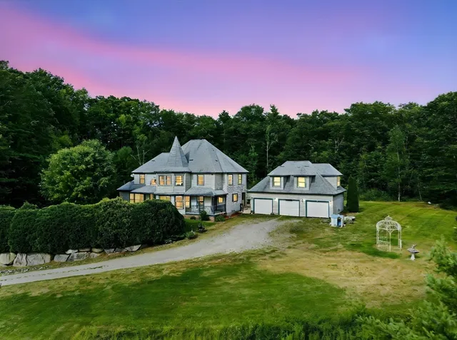 a view of a large garden with large trees and a big yard