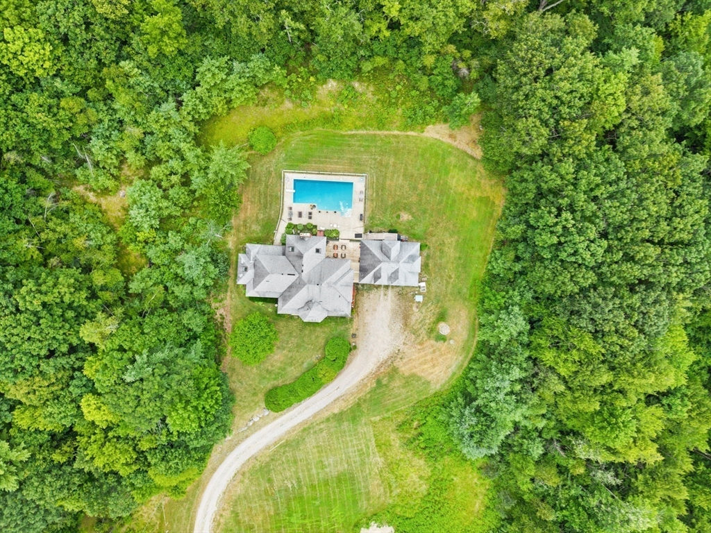 103 Renshaw Road Weare, NH 03281 - Photo 4 of 42 a view of a house with a backyard