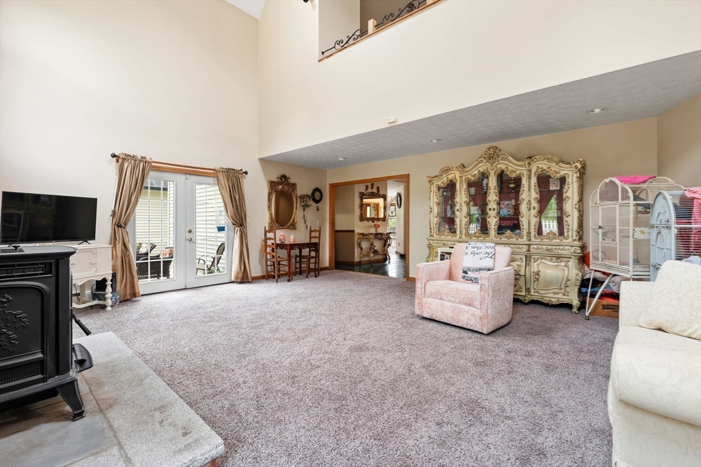 103 Renshaw Road Weare, NH 03281 - Photo 7 of 42 a living room with furniture and a flat screen tv