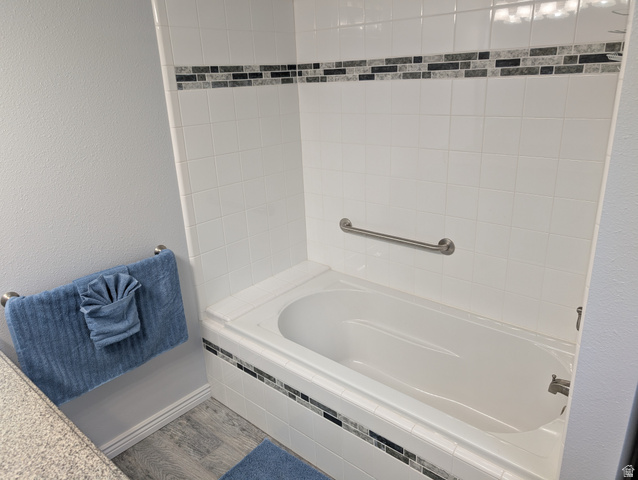 897 East 1200 North Mapleton, UT 84664 - Photo 34 of 54 Full bath with wood finished floors, a textured wall, and tub / shower combination