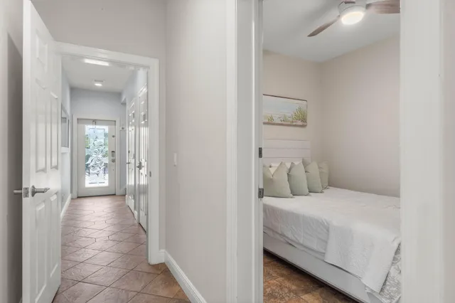 a bedroom with a bed and a painting on the wall