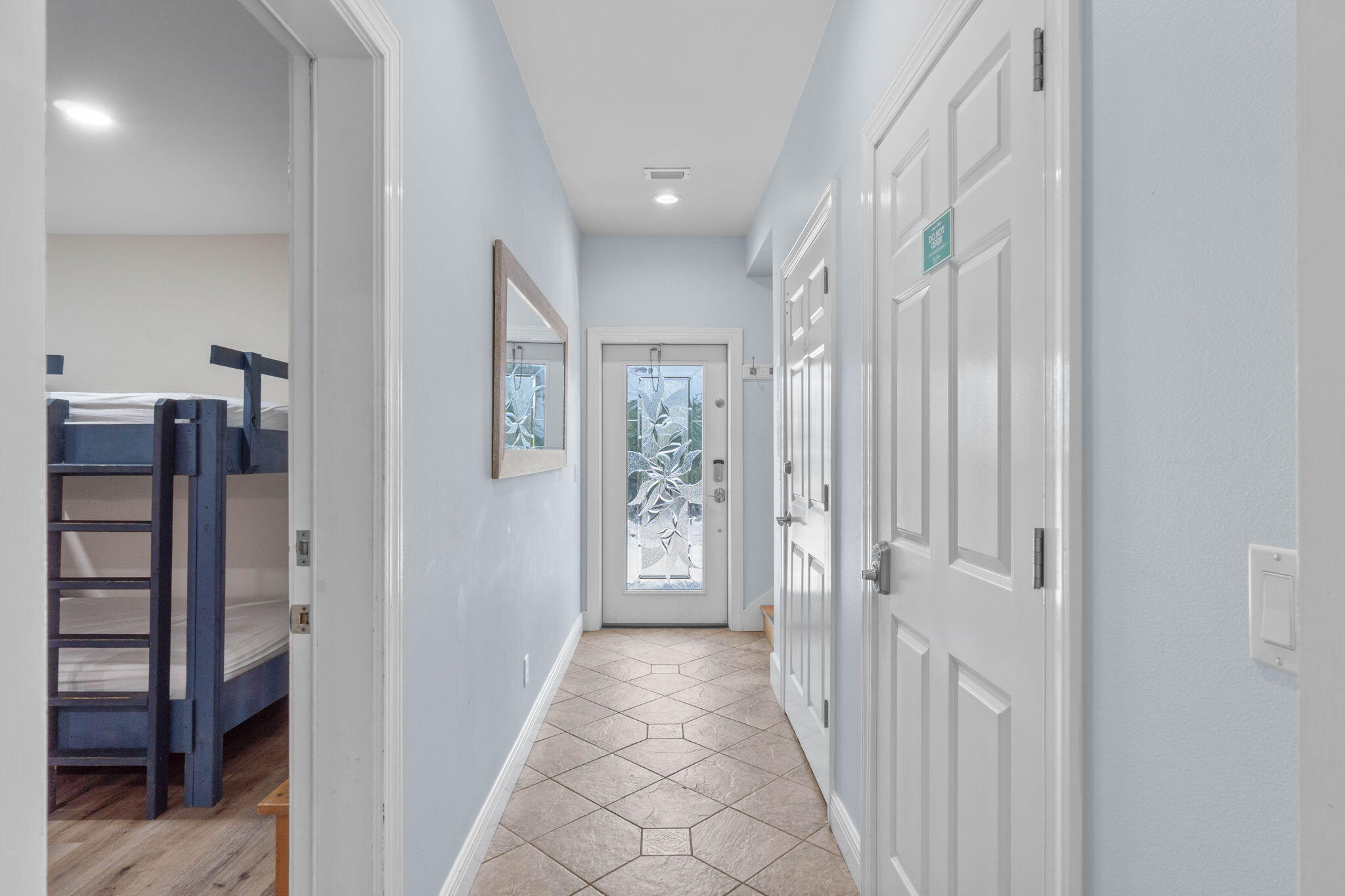 226 Sandtrap Road Miramar Beach, FL 32550 - Photo 2 of 63 a view of a hallway with wooden floor and entryway