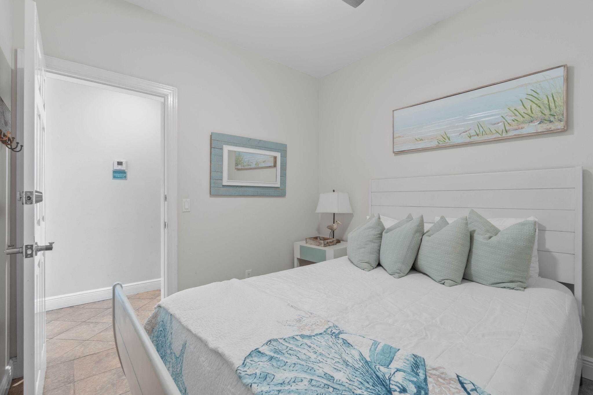 226 Sandtrap Road Miramar Beach, FL 32550 - Photo 21 of 63 a bedroom with a bed and a painting on the wall