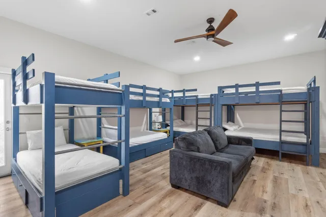 a bathroom with a double vanity sink mirror and toilet
