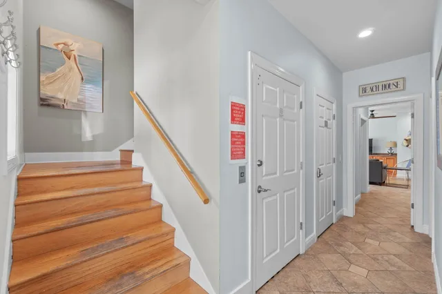 a view of entryway and hall with wooden floor