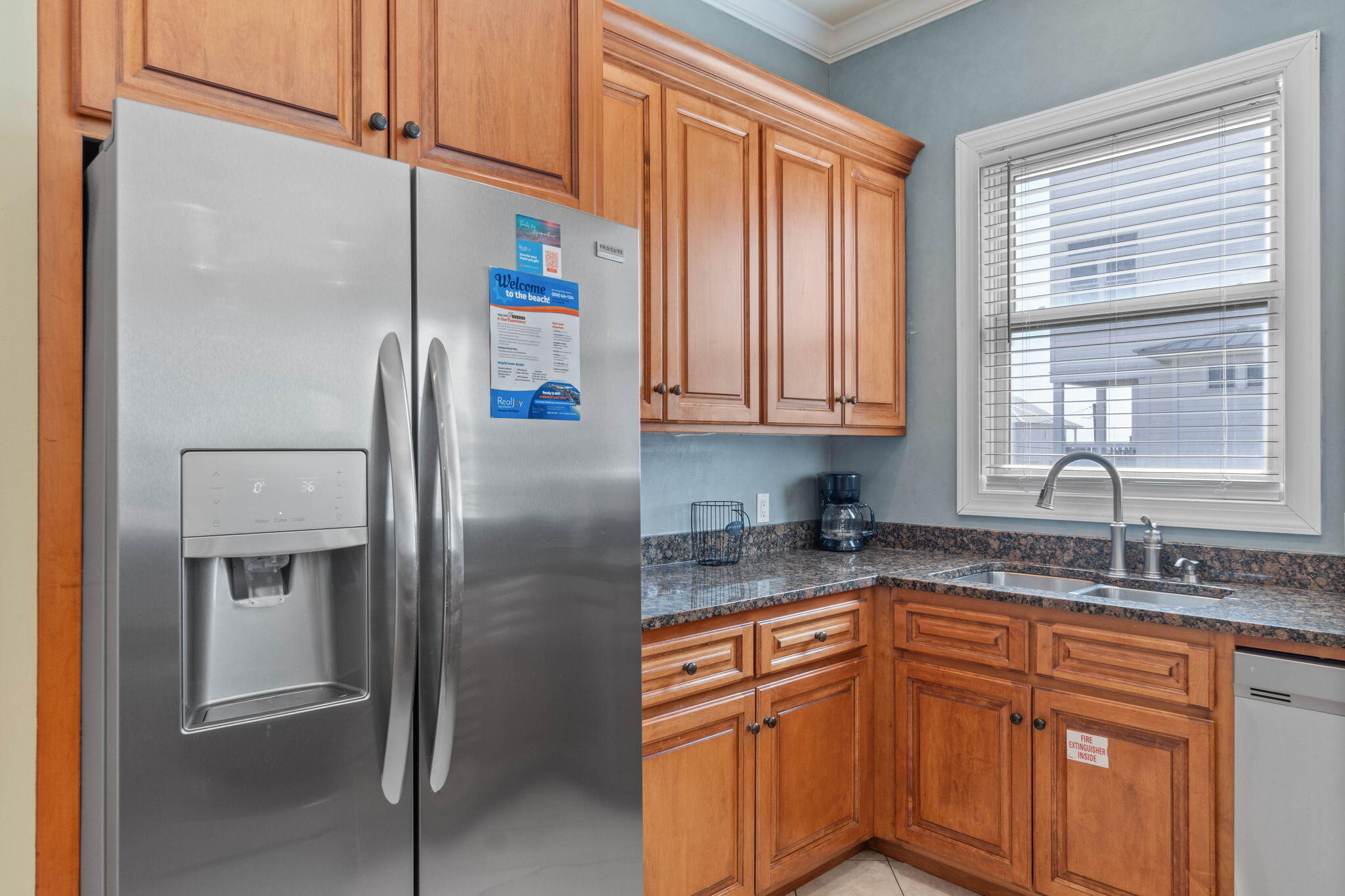 226 Sandtrap Road Miramar Beach, FL 32550 - Photo 33 of 63 a kitchen with stainless steel appliances granite countertop a refrigerator and a sink