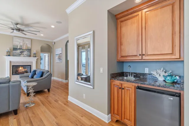 a spacious bedroom with a bed and a flat screen tv