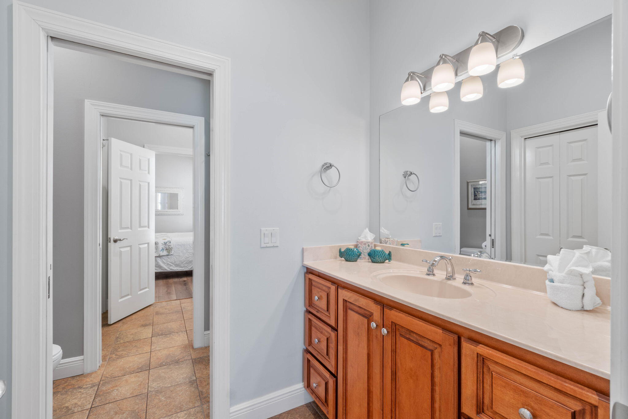 226 Sandtrap Road Miramar Beach, FL 32550 - Photo 46 of 63 a bathroom with a sink a vanity and a mirror
