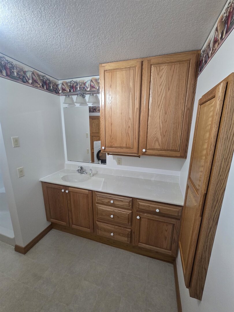 12719 Garden Plain Road Morrison, IL 61270 - Photo 16 of 85 a view of room with cabinets and wooden floor