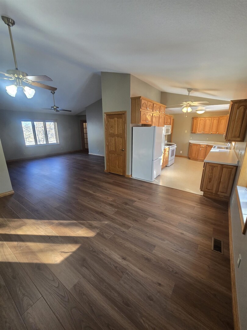 12719 Garden Plain Road Morrison, IL 61270 - Photo 33 of 85 a view of a livingroom with furniture hardwood floor and a ceiling fan