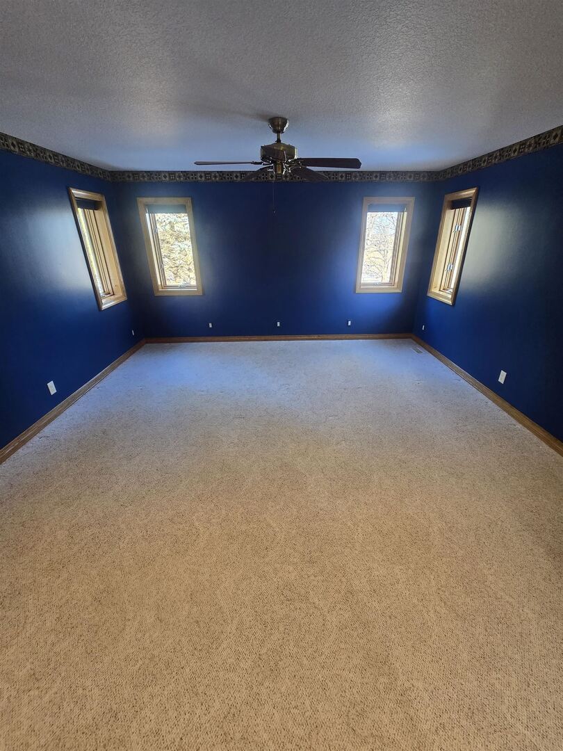 12719 Garden Plain Road Morrison, IL 61270 - Photo 43 of 85 a view of an empty room with windows and cabinet