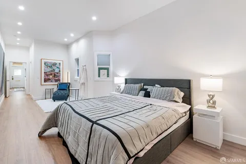 a bed room with a bed and a couch